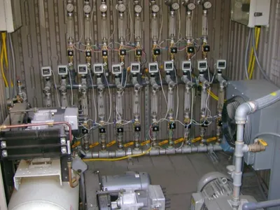 Multi-point vapor-extraction manifold of flowmeters and gauges with blowers in an equipment shed
