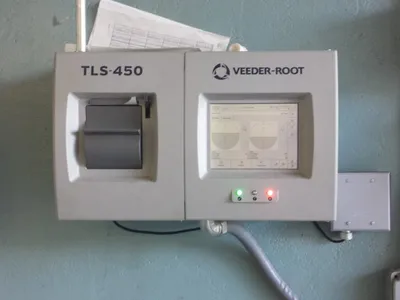 Veeder-Root TLS-450 automatic tank gauge mounted on a wall