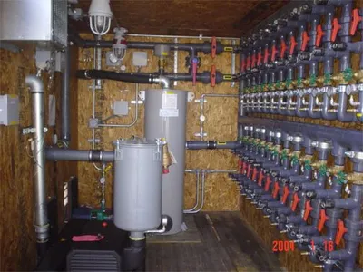 Treatment vessels and PVC valve manifold inside a remediation system enclosure