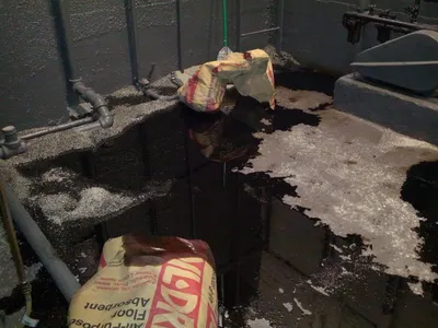 Indoor fuel spill contained with absorbent granules and floor-absorbent bags